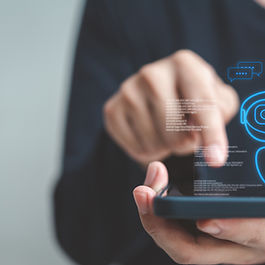 Person using a smartphone with a digital chat interface, representing a Copilot HR chatbot for company policies and rules.